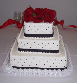 bride's cake with roses on top