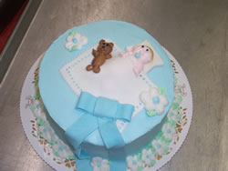 baby boy cake with teddy bear and blanket