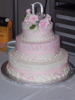 wedding cake with pink accents
